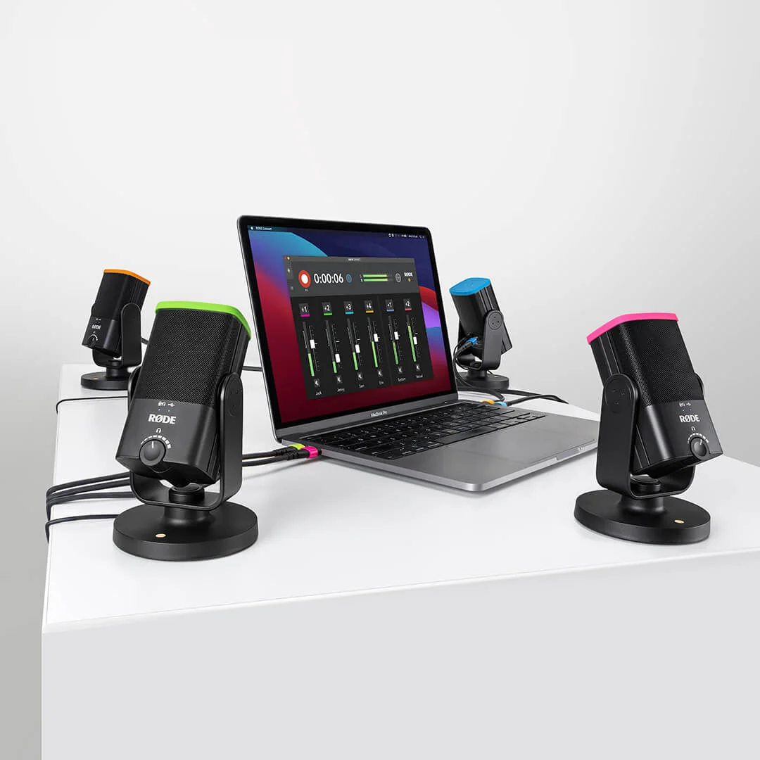 Four NT-USB Minis using COLORS around MacBook showing RØDE Connect