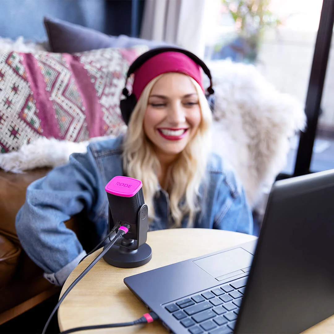 Girl on laptop with NT-USB Mini connected and talking into it